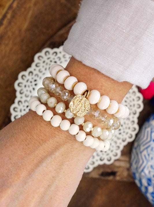 Beaded Bracelets set in White with a coin charm