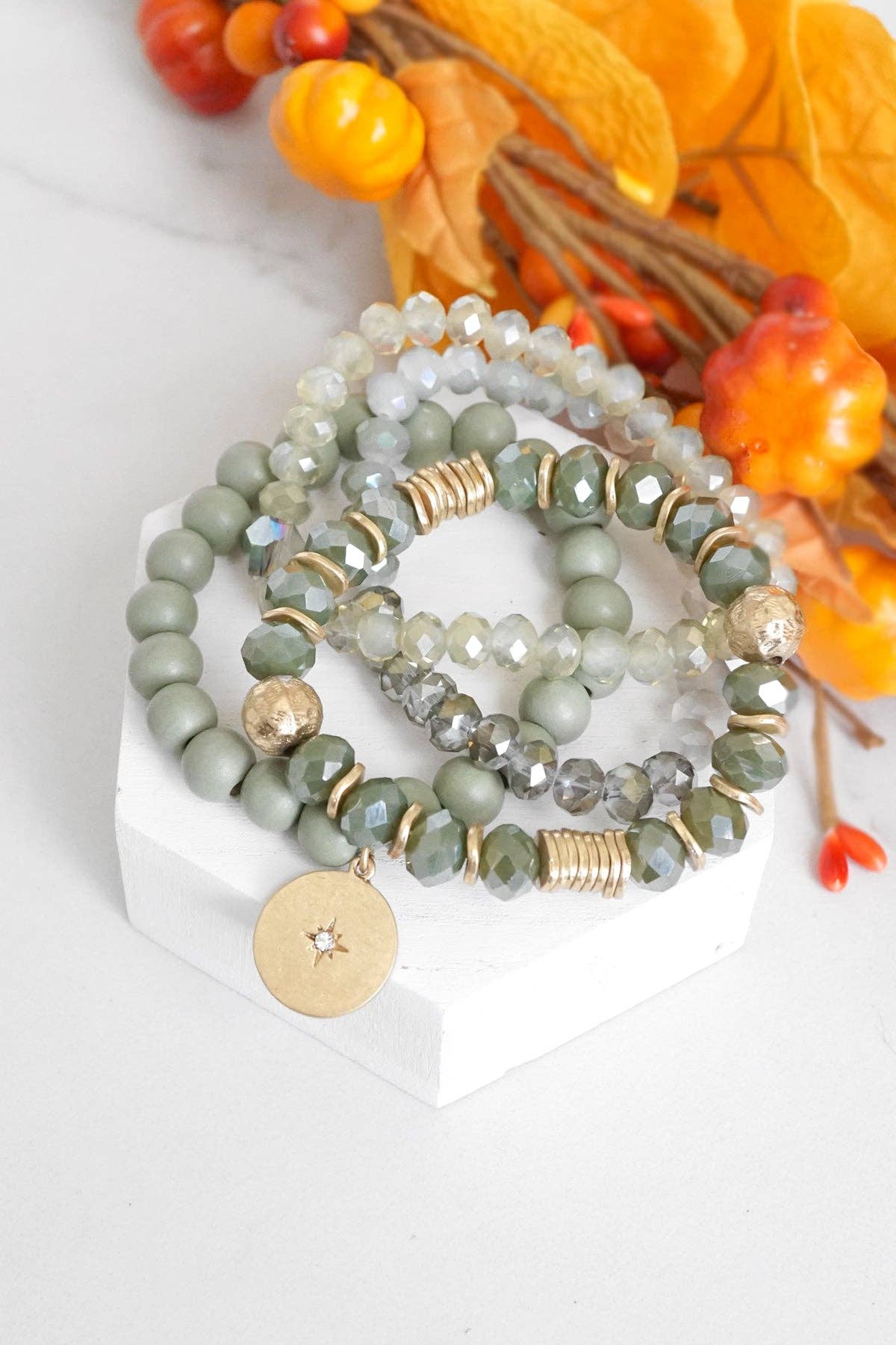 Beaded bracelets stack in Olive green with a coin charm